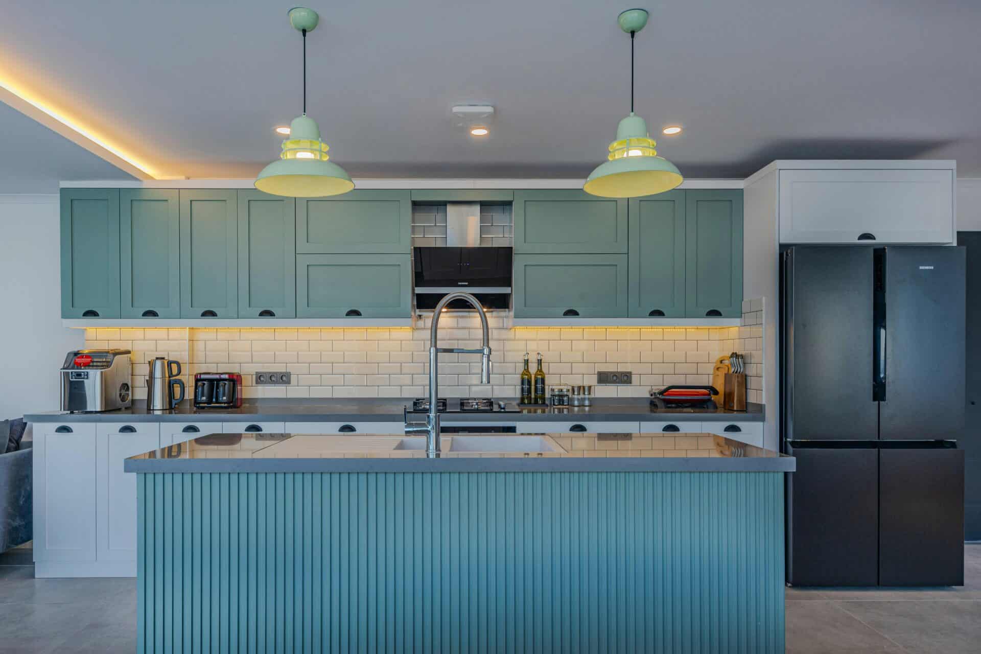 blue green painted cabinets in a kitchen