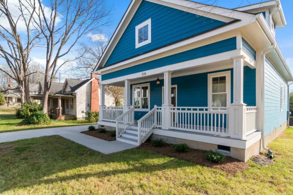A bright blue painted house exterior with white accents.
