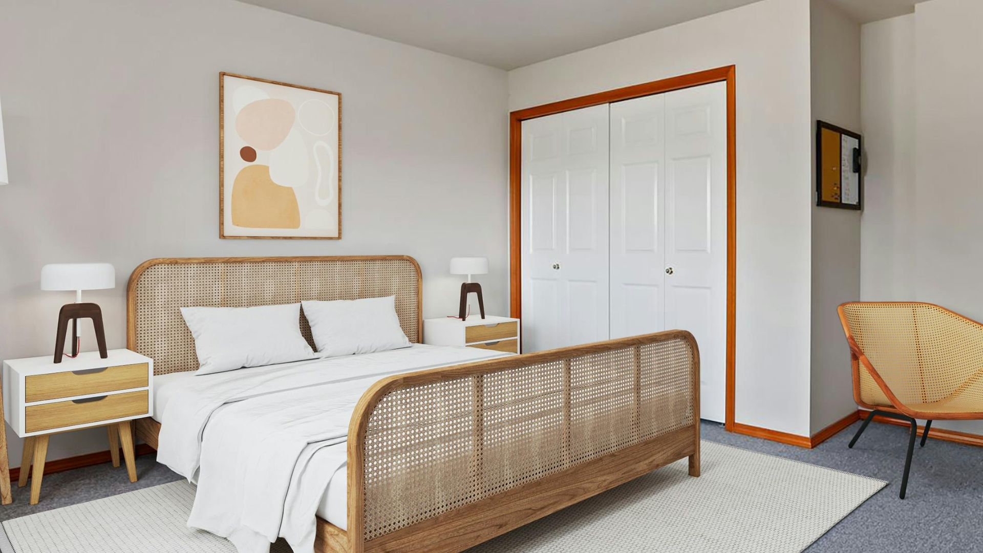 A bright, neutral toned bedroom with vibrant orange base board painted trim.